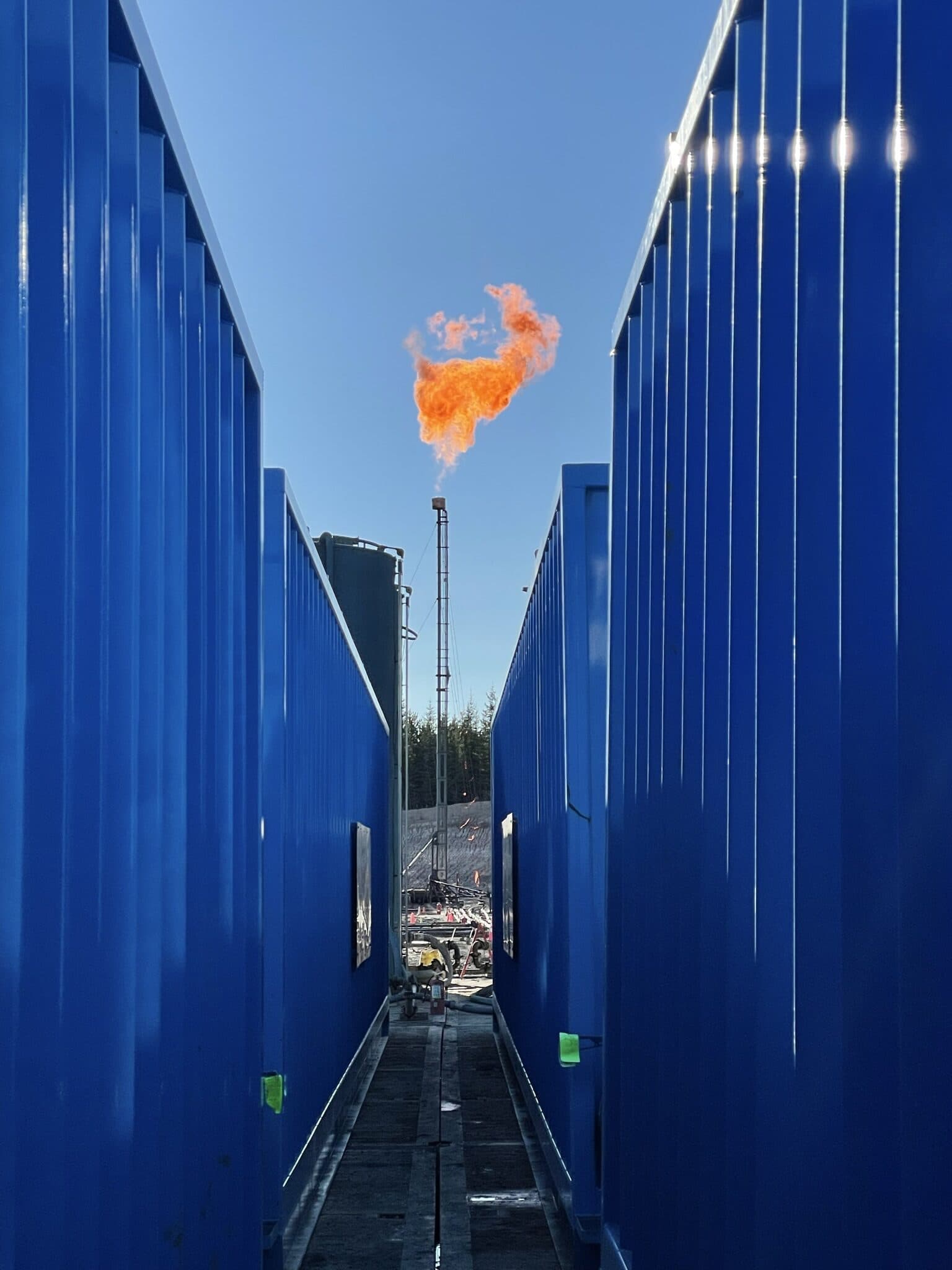 Flare stack operating at a Stimulate Energy Services job site